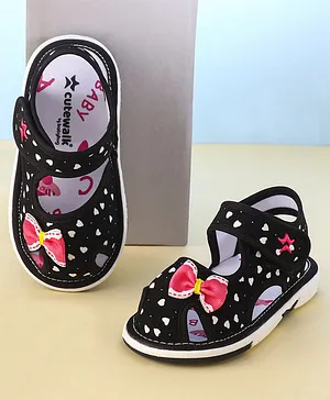Cute Walk by Babyhug Velcro Closure Musical Sandals with Heart Print & Bow - Black