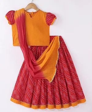 Exclusive from Jaipur  Cotton Woven Half Sleeves Bandhani Printed Choli & Lehenga Set with Dupatta - Red & Orange