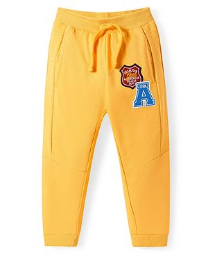 Babyhug Terry Knit  Full Length Cut & Sew Track Pants with Sport Theme & Text Print - Yellow