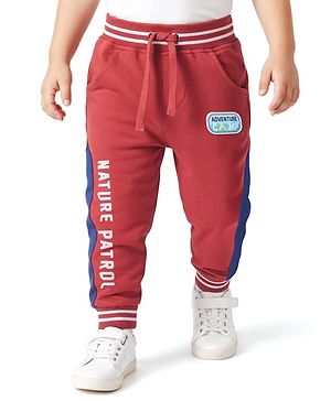 Babyhug Cotton Looper Knit Full Length Track Pant With Nature Patrol Print - Rust Orange