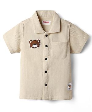 Babyhug Cotton Waffle Woven Half Sleeves Resort Collar Solid Shirt With Teddy Bear Patch - Cream