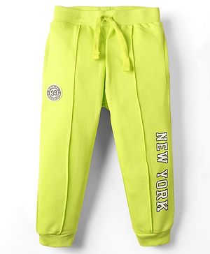 Babyhug Terry Cotton Knit Full Length Cut & Sew Lounge Pant With Text Print & Patch - Lime Green