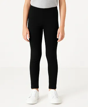 Charm n Cherish Cotton Blend Knit
                              Solid Leggings - Black