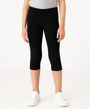 Charm n Cherish Cotton Blend Knit
                              Solid Capri Leggings - Black