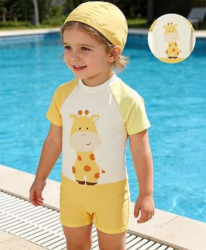 Babyhug Raglan Half Sleeves Giraffe Printed Legged Swimsuit With Cap - Light Yellow & White