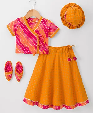 Exclusive from Jaipur Cotton Woven
                              Half Sleeves Printed Choli Lehenga Set
                              With Cap & Booties - Red &
                              Mustard