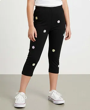 Kiddopanti Cotton Spandex Knit Stone
                              Embellished Floral Printed Capri Leggings
                              - Black