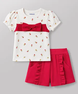 Babyoye Interlock Knit Half Sleeves
                              Eco Conscious T-Shirt & Shorts Set
                              With Eco Jiva Finish Floral Print &
                              Bow Applique - White & Red