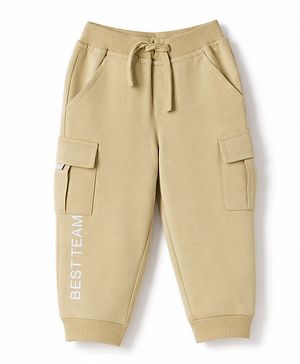 Babyhug Cotton Terry Knit Full Length Solid Lounge Pant with Cargo Pockets & Best Team Text Print - Cream