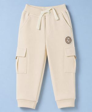 Babyhug Cotton Terry Knit Solid Lounge Pant with Cargo Pocket in Cream