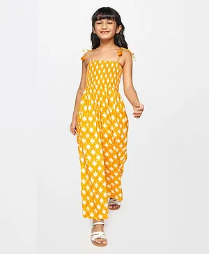 Global Desi Girl Sleeveless Ikat Motif Detailed & Smocked Bodice Jumpsuit With Shoulder Tie Up - Mustard Yellow