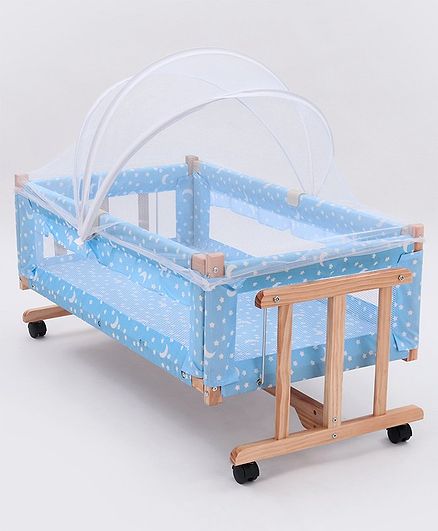 wooden cradle with mosquito net