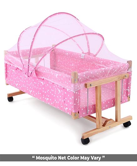 wooden cradle with mosquito net