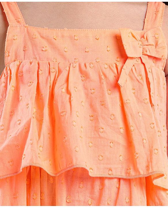 Babyhug Sleeveless Swiss Dot Woven Top With Bow & Frill Detailing - Peach