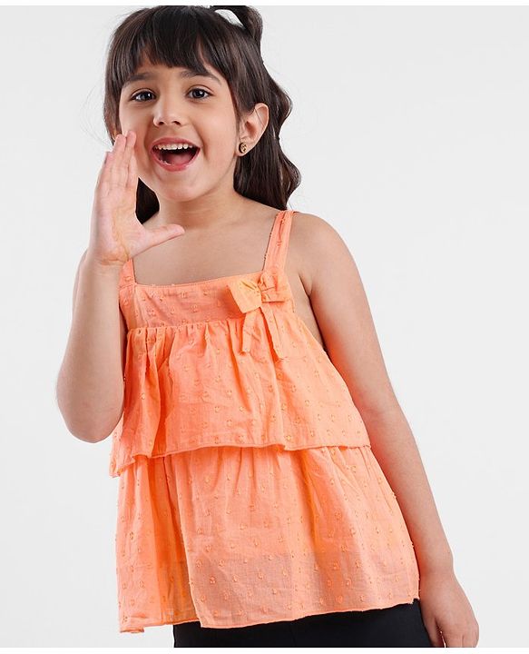 Babyhug Sleeveless Swiss Dot Woven Top With Bow & Frill Detailing - Peach