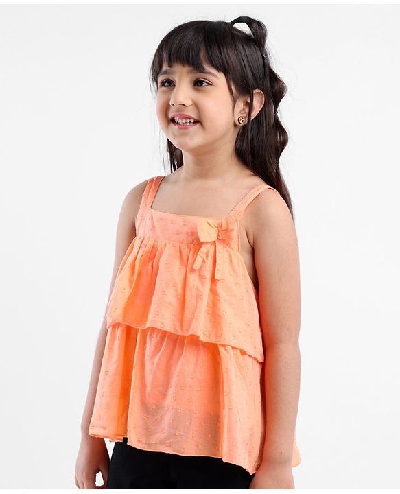 Babyhug Sleeveless Swiss Dot Woven Top With Bow & Frill Detailing - Peach