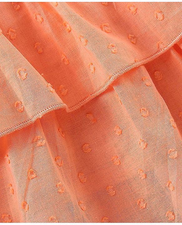 Babyhug Sleeveless Swiss Dot Woven Top With Bow & Frill Detailing - Peach