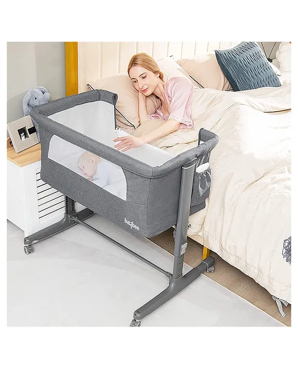 Baby bed adjustable outlet height