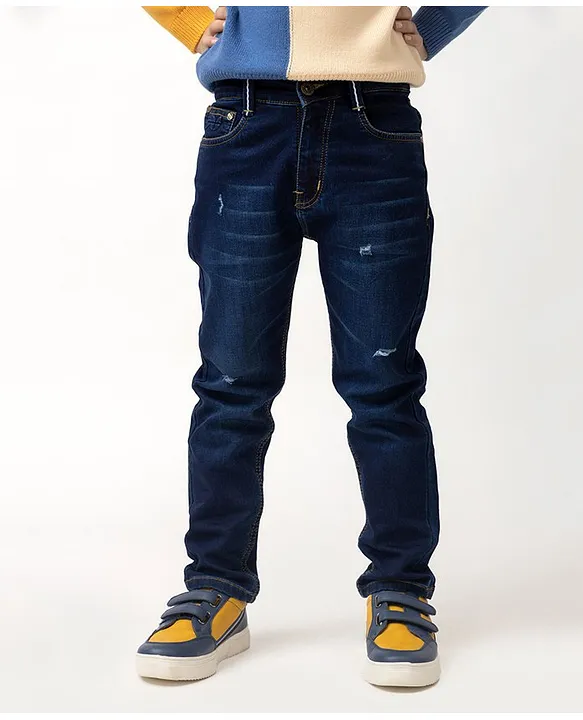 Premium Photo | Blue jeans fabric texture. Distressed denim background