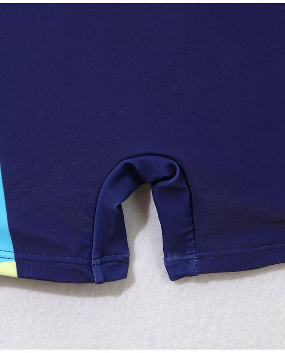 Babyhug Half Sleeves Legged Swimsuit with Cap Giraffe Print - Navy Blue