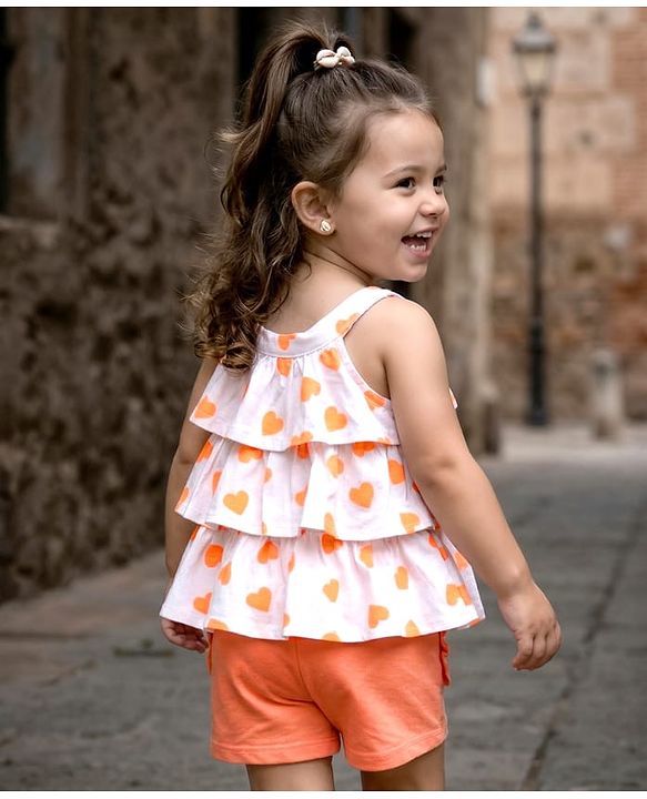Babyhug 100% Cotton Single Jersey Knit Singlet Sleeves Top & Shorts Set With Heart Print & Bow Applique - Orange