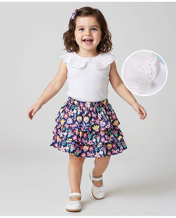 Babyhug Single Jersey Knit Sleeveless Schiffli Peter Pan Collar Top & Skirt Set With Floral Print & Bow Applique - White & Navy Blue