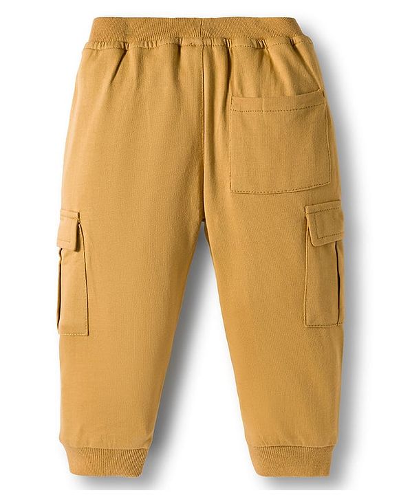 Babyhug French Terry Knit Full Length Lounge Pant With Badge Detailing & Cargo Pockets - Cream
