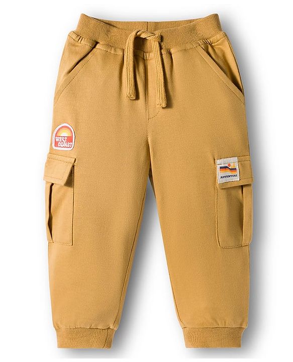 Babyhug French Terry Knit Full Length Lounge Pant With Badge Detailing & Cargo Pockets - Cream