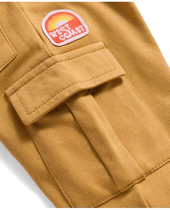 Babyhug French Terry Knit Full Length Lounge Pant With Badge Detailing & Cargo Pockets - Cream