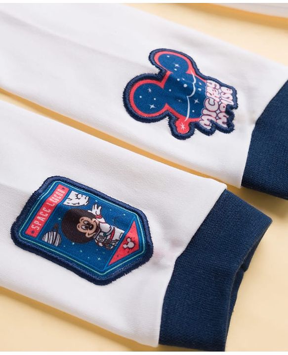 Babyhug Disney Interlock Knit Full Sleeves Hooded Romper With Mickey Mouse Graphics & Badge Detailing - White