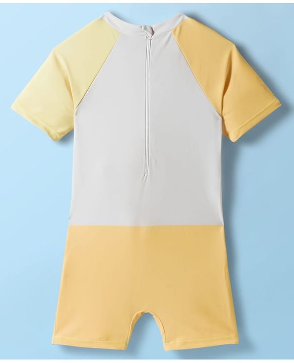 Babyhug Raglan Half Sleeves Giraffe Printed Legged Swimsuit With Cap - Light Yellow & White