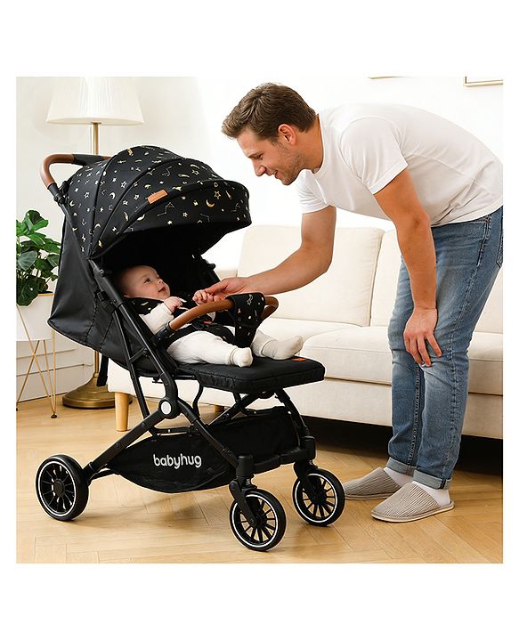 Babyhug Portable Baby Stroller with One-Hand Compact Fold Newborn Pram Concealed Linked Brake, Front Swivel Wheels, Safety Harness, Shock Absorbing Wheels Storage Basket Moon & Star Print - Black
