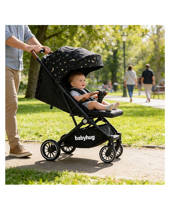 Babyhug Portable Baby Stroller with One-Hand Compact Fold Newborn Pram Concealed Linked Brake, Front Swivel Wheels, Safety Harness, Shock Absorbing Wheels Storage Basket Moon & Star Print - Black