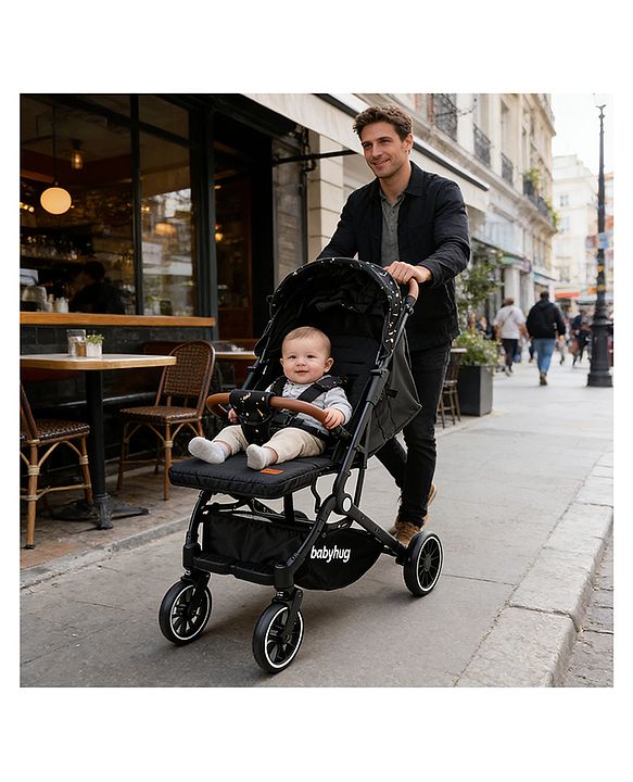 Babyhug Portable Baby Stroller with One-Hand Compact Fold Newborn Pram Concealed Linked Brake, Front Swivel Wheels, Safety Harness, Shock Absorbing Wheels Storage Basket Moon & Star Print - Black