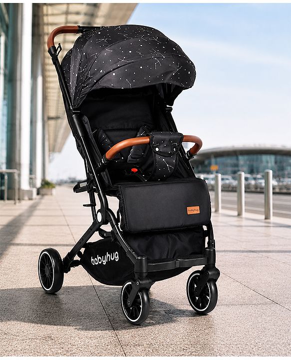 Babyhug Portable Baby Stroller with One-Hand Compact Fold Newborn Pram Concealed Linked Brake, Front Swivel Wheels, Safety Harness, Shock Absorbing Wheels Storage Basket Moon & Star Print - Black