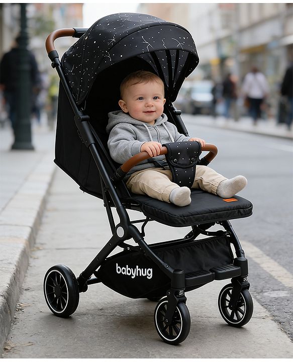 Babyhug Portable Baby Stroller with One-Hand Compact Fold Newborn Pram Concealed Linked Brake, Front Swivel Wheels, Safety Harness, Shock Absorbing Wheels Storage Basket Moon & Star Print - Black