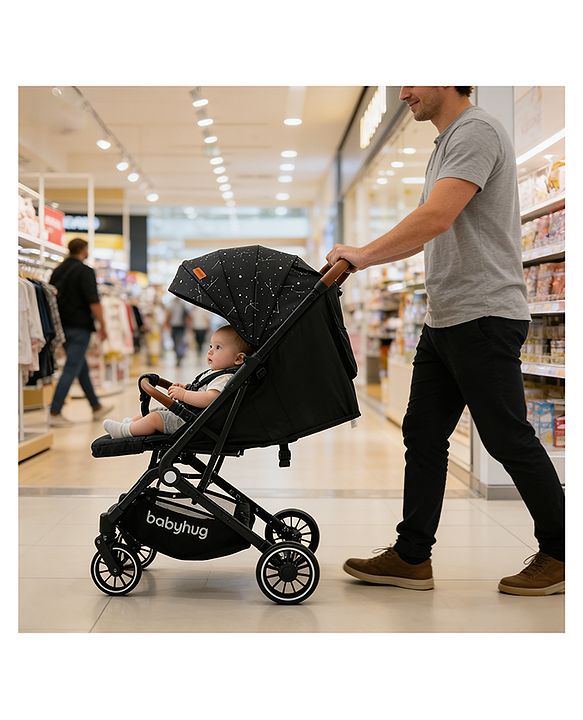 Babyhug Portable Baby Stroller with One-Hand Compact Fold Newborn Pram Concealed Linked Brake, Front Swivel Wheels, Safety Harness, Shock Absorbing Wheels Storage Basket Moon & Star Print - Black
