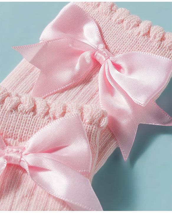 Cute Walk by Babyhug Non Terry Knit Calf Length Solid Party Socks with Bow Applique & Cable Knit Design - Pink