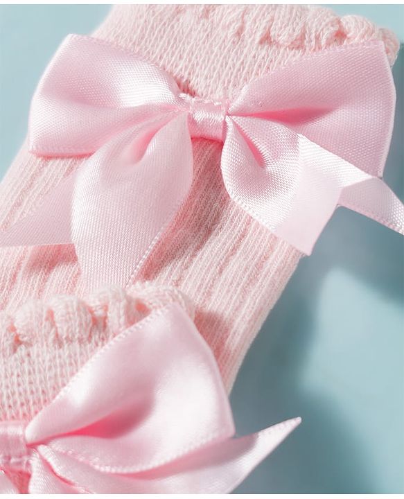 Cute Walk by Babyhug Non Terry Knit Calf Length Solid Party Socks with Bow Applique & Cable Knit Design - Pink