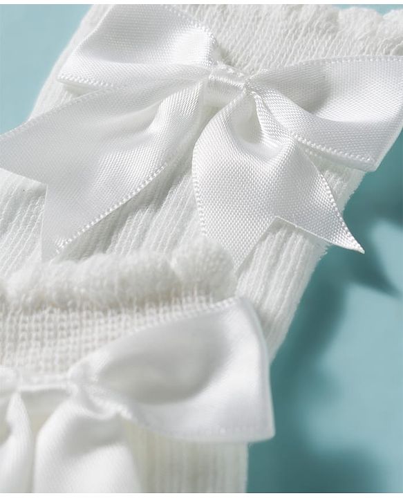Cute Walk by Babyhug Non Terry Knit Calf Length Solid Party Socks with Bow Applique & Cable Knit Design - Pink
