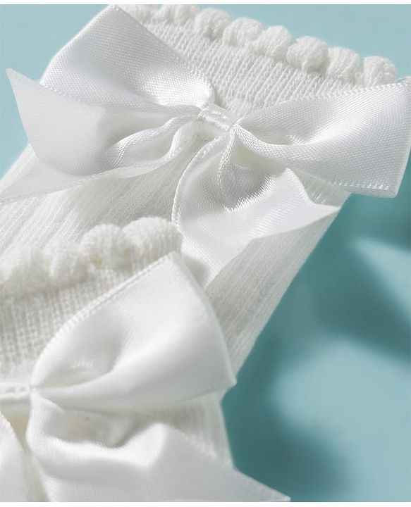 Cute Walk by Babyhug Non Terry Knit Calf Length Solid Party Socks with Bow Applique & Cable Knit Design - Pink