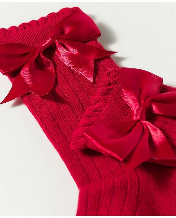 Cute Walk by Babyhug Non Terry Knit Calf Length Solid Party Socks with Bow Applique & Cable Knit Design - Pink
