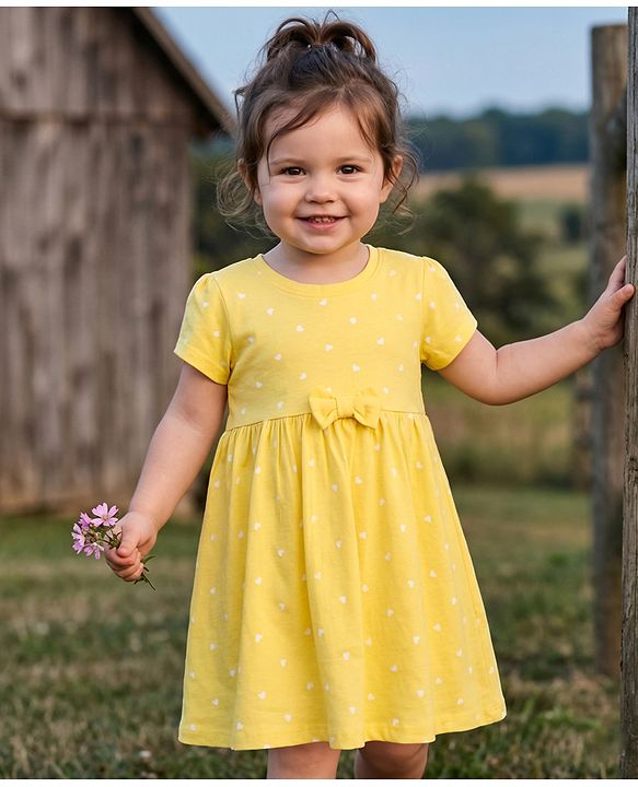 Babyhug 100% Cotton Knit Half Sleeves Hearts Printed Frock With Bow Applique- Yellow