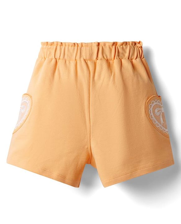Babyhug Terry Knit Mid Thigh Shorts With Heart Embroidery & Bow Applique - Peach