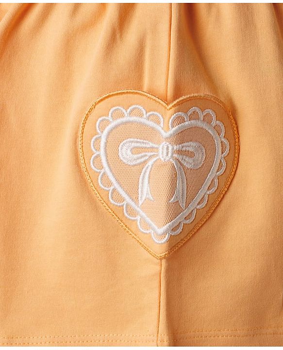 Babyhug Terry Knit Mid Thigh Shorts With Heart Embroidery & Bow Applique - Peach