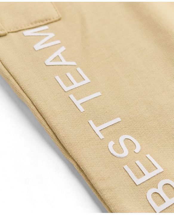 Babyhug Cotton Terry Knit Full Length Solid Lounge Pant with Cargo Pockets & Best Team Text Print - Cream
