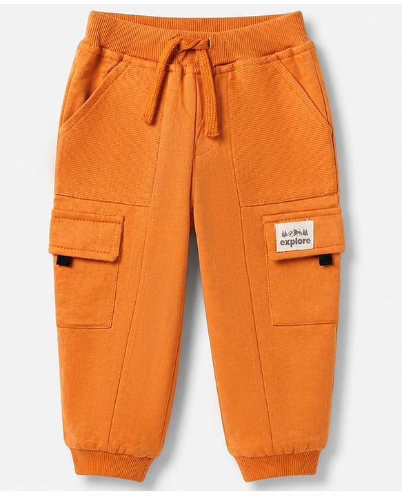Babyhug Cotton Terry Full Length Knit Track Pant with Ribbed Waist and Explore Patch in Rust Orange