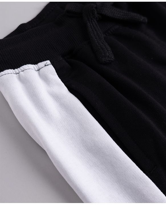 Pine Kids Knit Full Length Track Pant with Cut & Sew Design & Text Print - Black