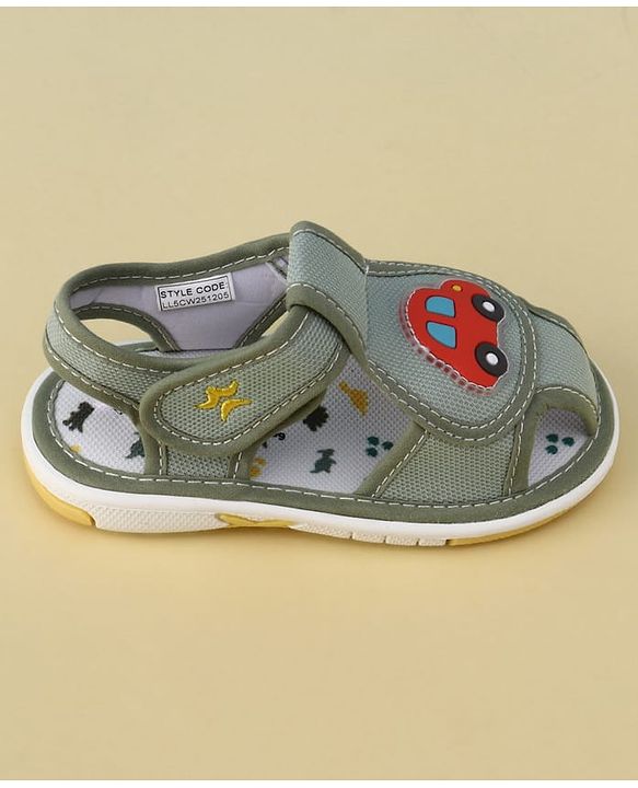 Cute Walk by Babyhug Velcro Closure Printed Musical Sandal With Vehicles & Dino Applique - Olive Green