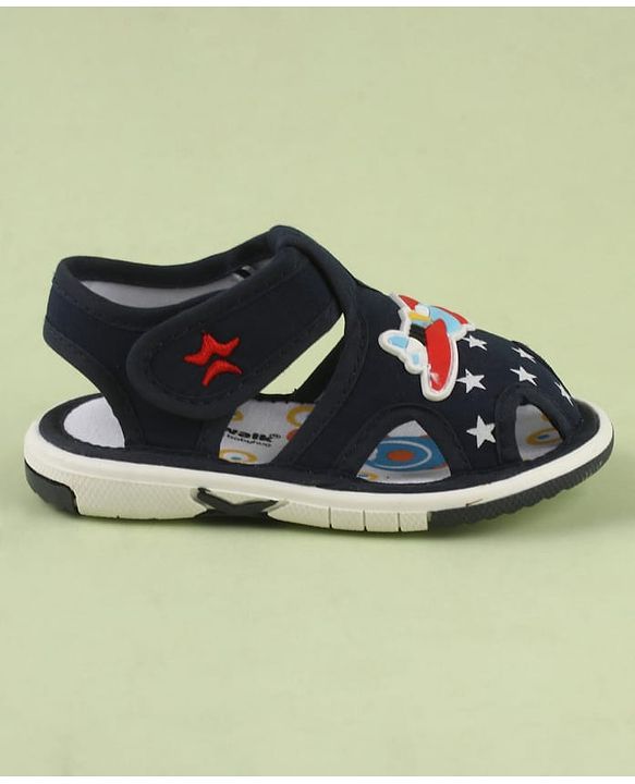 Cute Walk by Babyhug Velcro Closure Musical Sandal With Star  Print & Aeroplane Applique - Blue